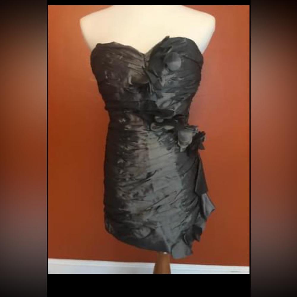 Very pretty grey strapless dress.